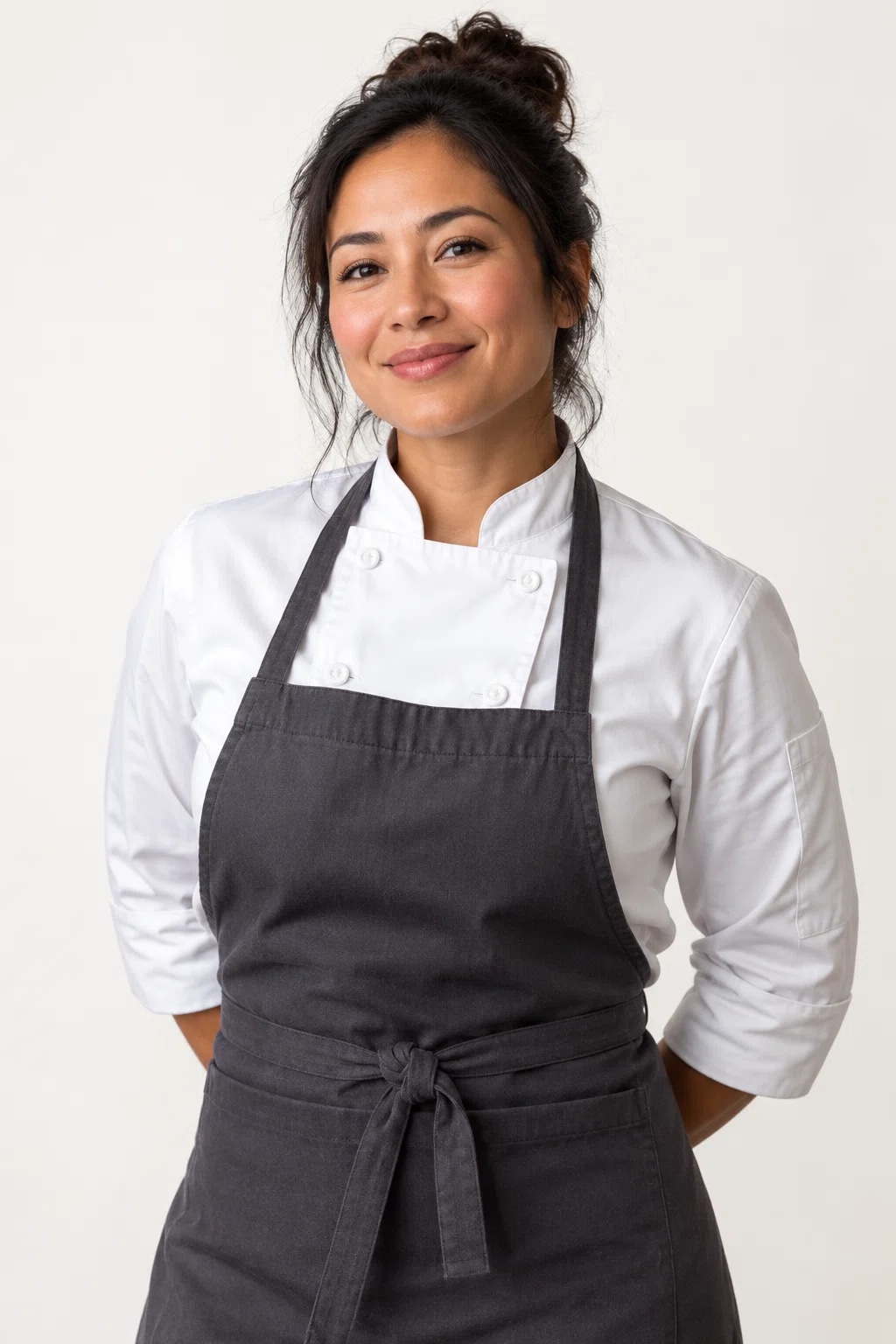 Chef wearing a plain restaurant uniform and apron